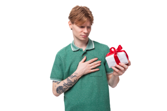 joyful happy young redhead guy in green t-shirt got birthday gift box - Powered by Adobe