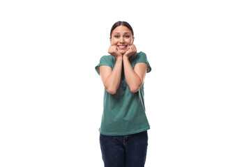 young happy brunette woman in t-shirt rejoices on white background with copy space