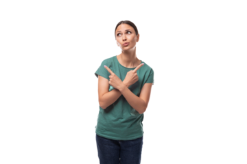 young beautiful brunette lady dressed in a green t-shirt and jeans draws attention with gestures