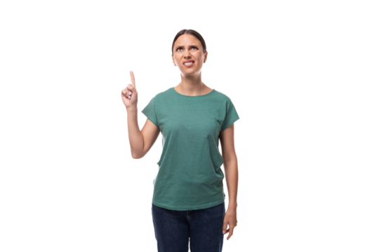 A 30 year old positive European brunette woman with a ponytail is dressed in a green T-shirt and jeans talks about advertising