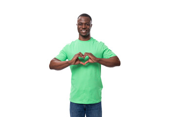 young friendly american man dressed in green t-shirt and jeans