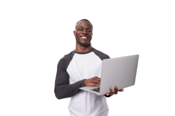 young african man working remotely in the field of IT and using a laptop