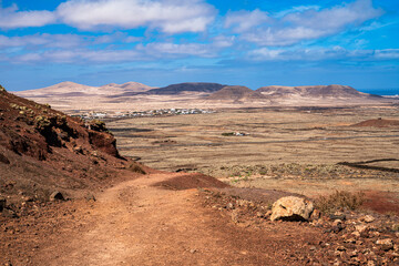 Walking trail where you can see beautiful views of several volcanoes in the area. Photography taken in Fuerteventura, Canary Islands, Spain