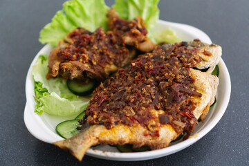 Fried Fish with Chile Paste. Traditional Indonesian and Malaysian Dish