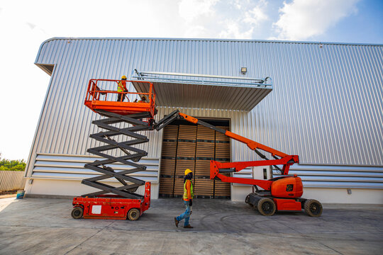 Workers working on the construction site of the new factory industry for boom