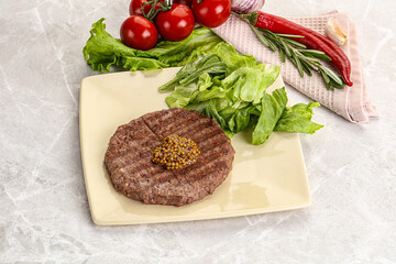 Frilled beef burger cutlet with iceberg