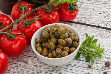 Marinated green capers in the bowl