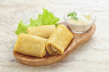 Stuffed pancakes with meat and cream