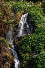 Fototapeta premium Close-up of waterfall with autumn foliage