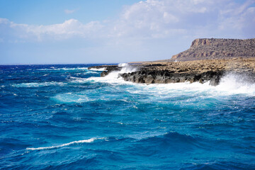 Choppy sea with a view of the mountain.