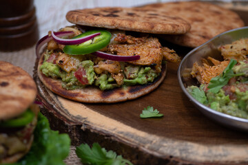 Pita bread filled with vegan meat seitan , sliced veggies and condiments