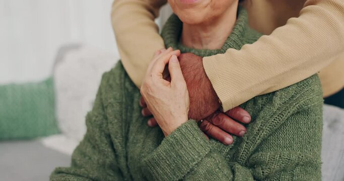 Couple, love and hug for empathy and support or security on home sofa. Closeup of man and woman together in living room for trust, compassion and help or touch for kindness with care in retirement