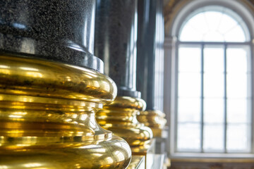 background: baroque interior, gilded foundations of stone columns against the background of a...