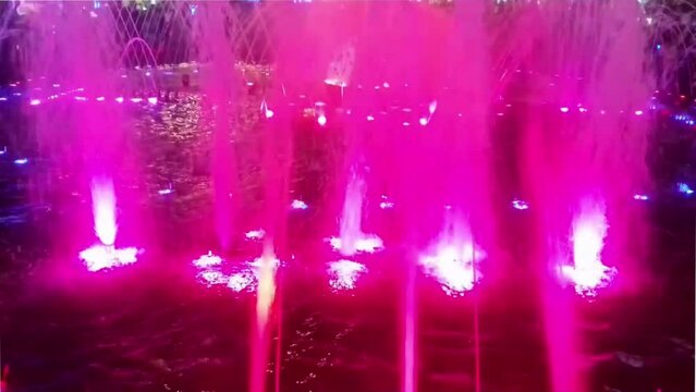 They are fountains of falling water in Sharm El Sheikh, South Sinai, Egypt. There are lots of people taking or recording videos of the fountains. Sharm El Sheikh is a landmark in Egypt.
