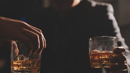 food and drink male friends are happy drinking beer and clinking glasses at a bar or pub.