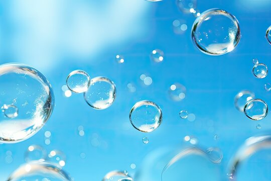 Blue water soap bubbles on a natural backdrop