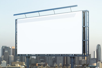 Obraz premium Blank white horizontal billboard on skyline background at daytime, perspective view. Mock up, advertising concept
