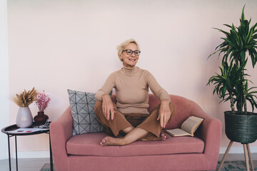 Woman spending free time in lounge room at home