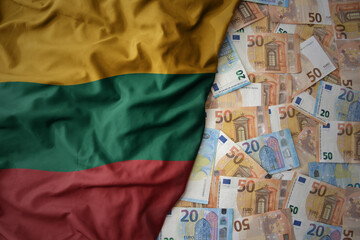 colorful waving national flag of lithuania on a euro money background. finance concept