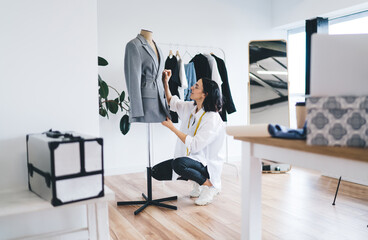 Female designer with suit and working in atelier