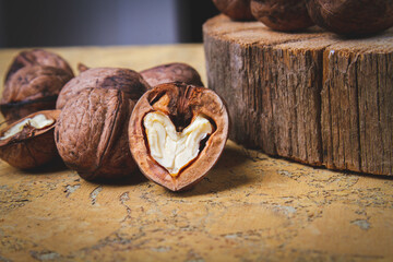 Walnut. Half walnut on natural background. Inshell nuts. Copyspace.