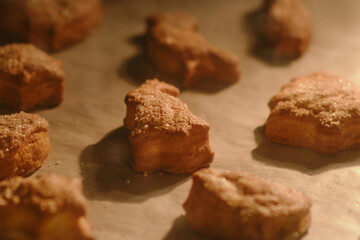 Process of baking cookies from puff pastry in the oven. Cooking cookies in the shape of a heart, an Easter bunny and other animals