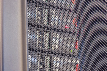 The UPS module in the server room is emitting a red light warning signifying an error with the...