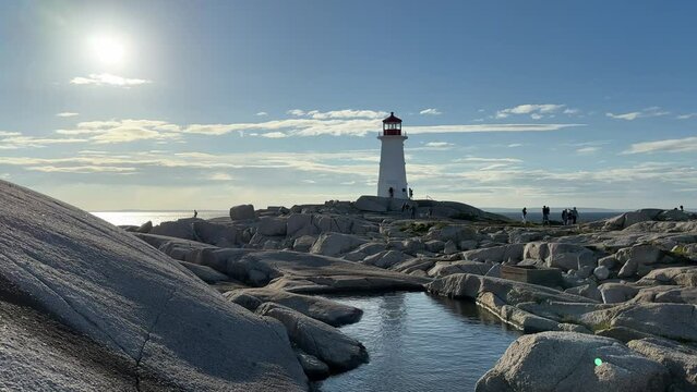 Seascape with a lighthouse on a rocky shore Peggys Cove Lighthouse Nova Scotia. 