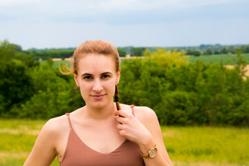 Young woman with braided hair at the Tisza