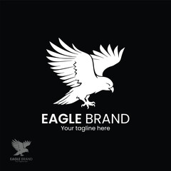 flying Eagle logo Design Vector illustration, Black background, Design element for logo, label, emblem, sign and symbol
