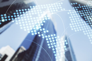 Double exposure of abstract digital world map hologram with connections on modern skyscrapers background, research and strategy concept