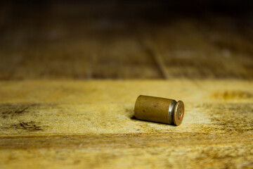 Bullet on wooden to check evidence of crime.