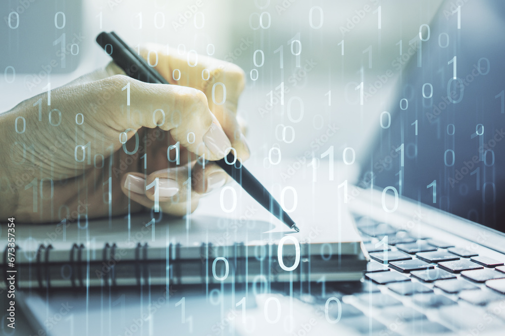 Leinwandbilder creative abstract binary code hologram and hand writing in diary on background with laptop, ai and m