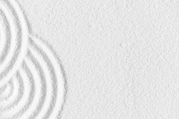 Fototapeta na wymiar Zen garden, Japanese garden with art line pattern on white sand background,Top Beach Sand Nature texture curve surface,Background Banner for Buddhism Meditation, Harmony,Calm,Feng Shui,Zen like