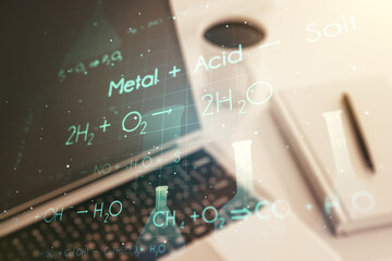 Creative chemistry hologram on modern laptop background, pharmaceutical research concept. Multiexposure