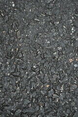 wet pavement texture, gray asphalt texture with red and white gravels 