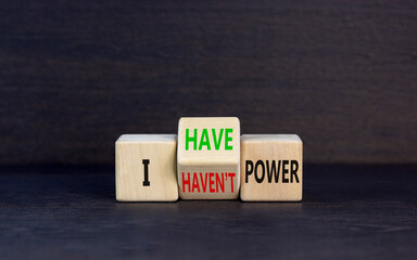 I have or not power symbol. Concept word I have or have not power on beautiful wooden cubes. Beautiful black table black background. Business and i have or not power concept. Copy space.