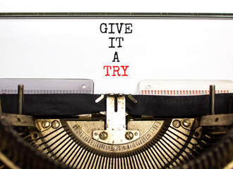 Give it a try symbol. Concept word Give it a try typed on beautiful old retro typewriter. Beautiful white paper background. Business give it a try concept. Copy space.