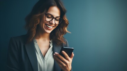 Fototapeta premium beautiful female entrepreneur wearing eyeglasses and reading good news over smart phone over blue background. generative AI