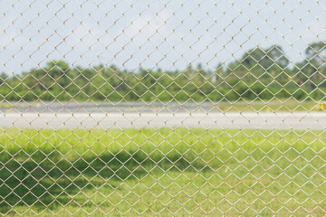 Green grass background and a Wire fence