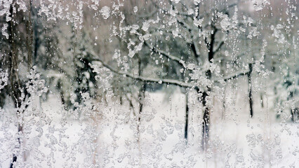 Winter frozen window covered with snow.