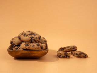 Oatmeal cookies with chocolate chips on an orange background. Classic oatmeal cookies with chocolate.