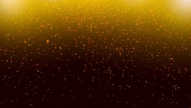 Golden glitter rain with dust light and gold particles. Golden sparks shimmer glow flow on luxury black and gold background. Gold dust bokeh abstract background
