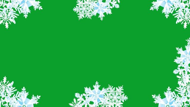 Big snowflakes frame on a green screen. Christmas and New Year snowflakes frame. Snowflakes frame with key color. Chroma key.