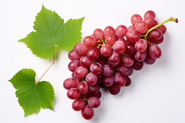 Isolated top view of partially sliced red grapes surrounded by green foliage on a white background.