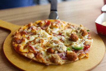 hawaiian pizza serve on wood tray with side dish Lasagna , spaghett , cheese ball