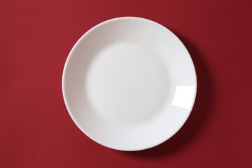 white plate on red background