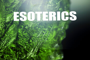 Esoterics text background. Green esoteric stone texture. Lens flare glow. Concept.