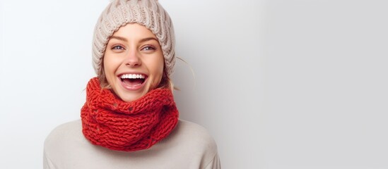 Portrait of a happy lady donning a beanie and a neck warmer