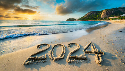 escrito en la arena de playa con el nuevo año 2024
